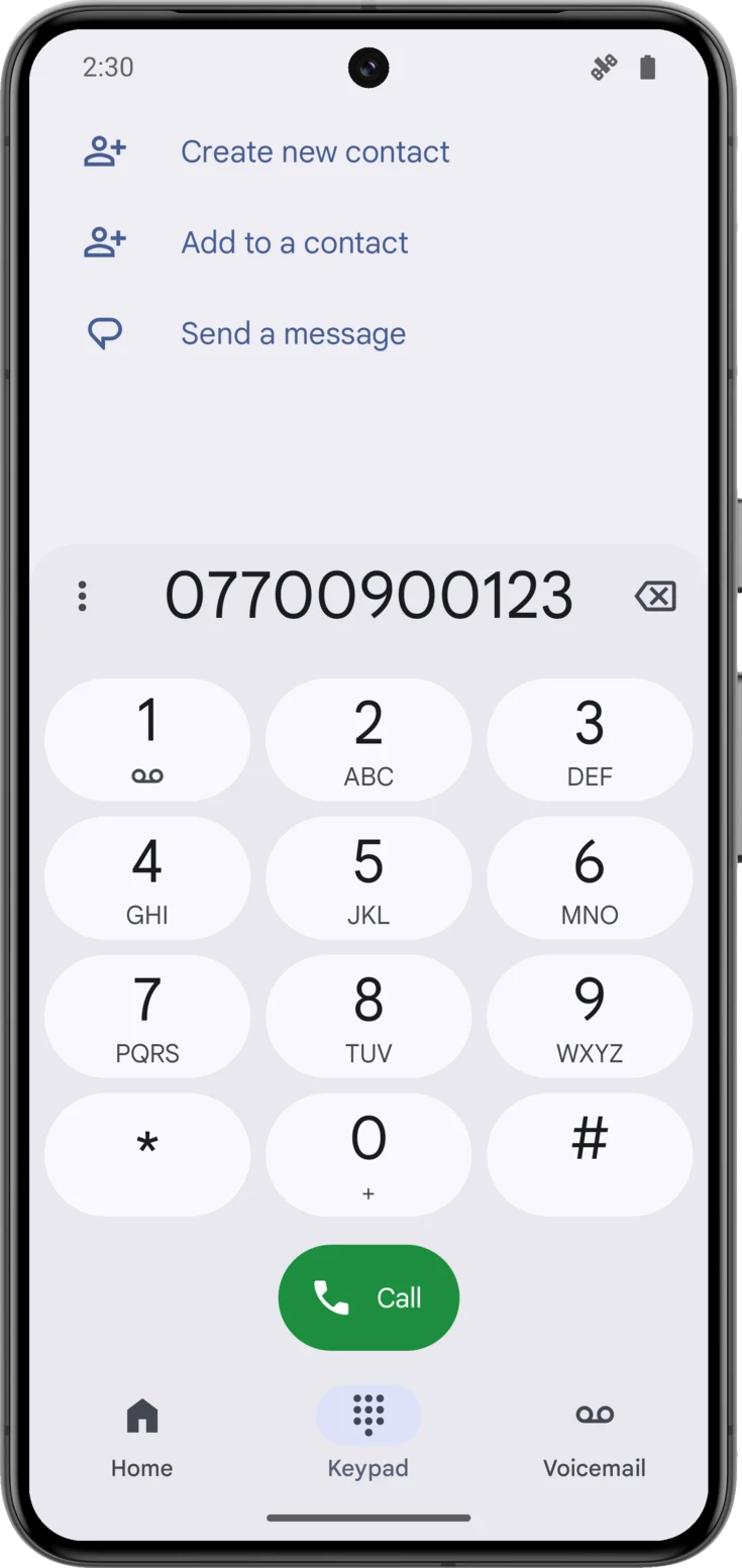 The phone's dialer with the family number already entered